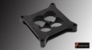 Black plastic fan guard with a four-blade design and mounting holes.
