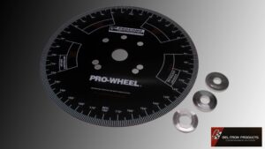 Black Pro-Wheel cutting guide with metal spacers on a white surface.