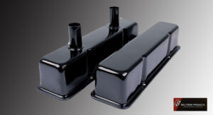 Glossy black engine valve covers with a sleek finish.