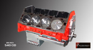Close-up of a red engine block with pistons and a Moroso oil pan.