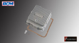 Metal transmission oil pan with gasket and bolts.