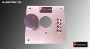 Metal panel with a large knob and four smaller knobs around a central hole.