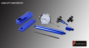 Precision measuring tools and blue metal components on a gray surface.