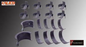 Various curved metal brackets arranged systematically on a surface.