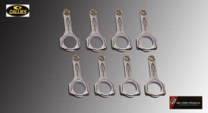 Eight metallic connecting rods arranged on a gray surface.