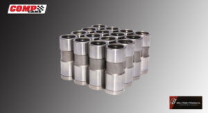 A stack of uniform metallic cylindrical objects arranged in a grid.