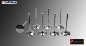 Set of shiny engine valves lined up on a reflective surface.