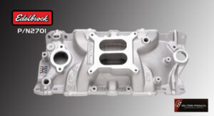 A white automotive intake manifold on a gray background.