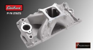 A metallic intake manifold for an engine with a polished finish.