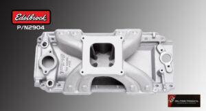 Silver engine intake manifold with a square central opening on a gray background.