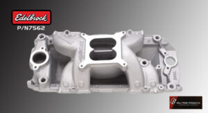 Silver metallic engine intake manifold with a dual throttle design.