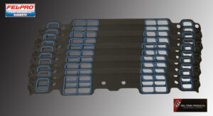 Metal rack with multiple rectangular slots and mounting holes.