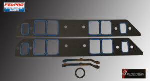 Disassembled keyboard parts including keycaps, spacebars, and stabilizers on a gray surface.