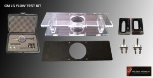Transparent plastic part with a circular hole, placed above a black rectangular piece with a matching hole.
