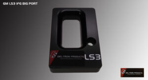 Black LS3 oil pan baffle plate with a rectangular cutout and a circular hole.