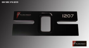 Close-up of a black metal object with a rectangular button and numeric marking.