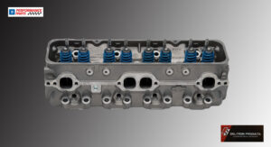 Close-up of an engine cylinder head showing valves and springs.