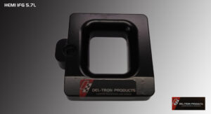 Black plastic object with a square hollow center and a label.