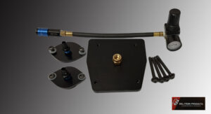 Disassembled black and gold mechanical parts with screws on a gray background.