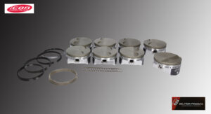 A set of six engine pistons with rings and clips arranged on a grey background.