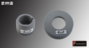 Two gray circular mechanical parts with grooves and labels.