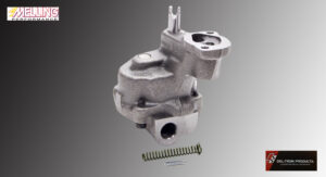 Metal automotive part with spring on gray background.