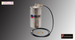 Stainless steel spray tank with hose and nozzle attachments.