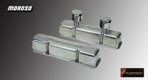 Pair of polished chrome valve covers with embossed lettering.