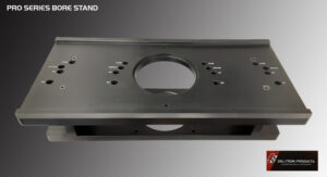Metal bracket with multiple holes and a large central opening for mounting purposes.