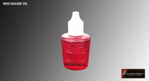 A small red bottle with a white nozzle cap against a gray background.