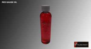 A clear plastic bottle filled with red liquid and a white cap.