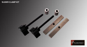 Precision-machined metal components with a sleek black and bronze finish.