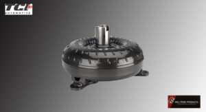 A black automotive torque converter with a metallic center.