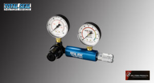 Dual pressure gauges attached to a blue gas regulator.