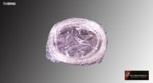 A round bowl wrapped in clear plastic wrap on a gray surface.