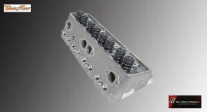 A metal engine cylinder head with valve springs and ports.