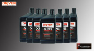 Row of Driven Racing oil bottles in various types and sizes.