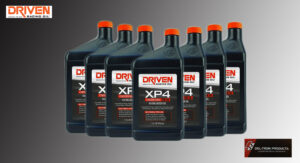 Several bottles of Driven XP4 synthetic oil lined up.