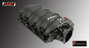 Close-up of a sleek black engine intake manifold with 'FAST' branding.