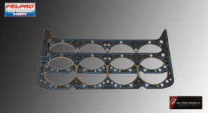Several engine gaskets arranged on a surface.
