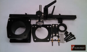 Disassembled mechanical parts with screws and mounting plates.