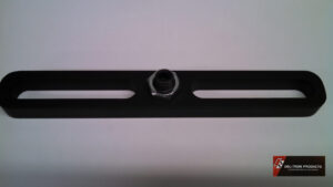 Close-up of a metal hex nut on a black slotted metal bracket.