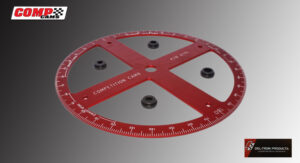 A red and silver circular measuring tool with marked scales.