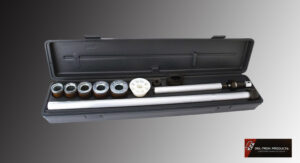 Close-up of a black audio device with control knobs and a power button.