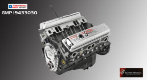 A detailed scale model of a V8 engine with visible components.